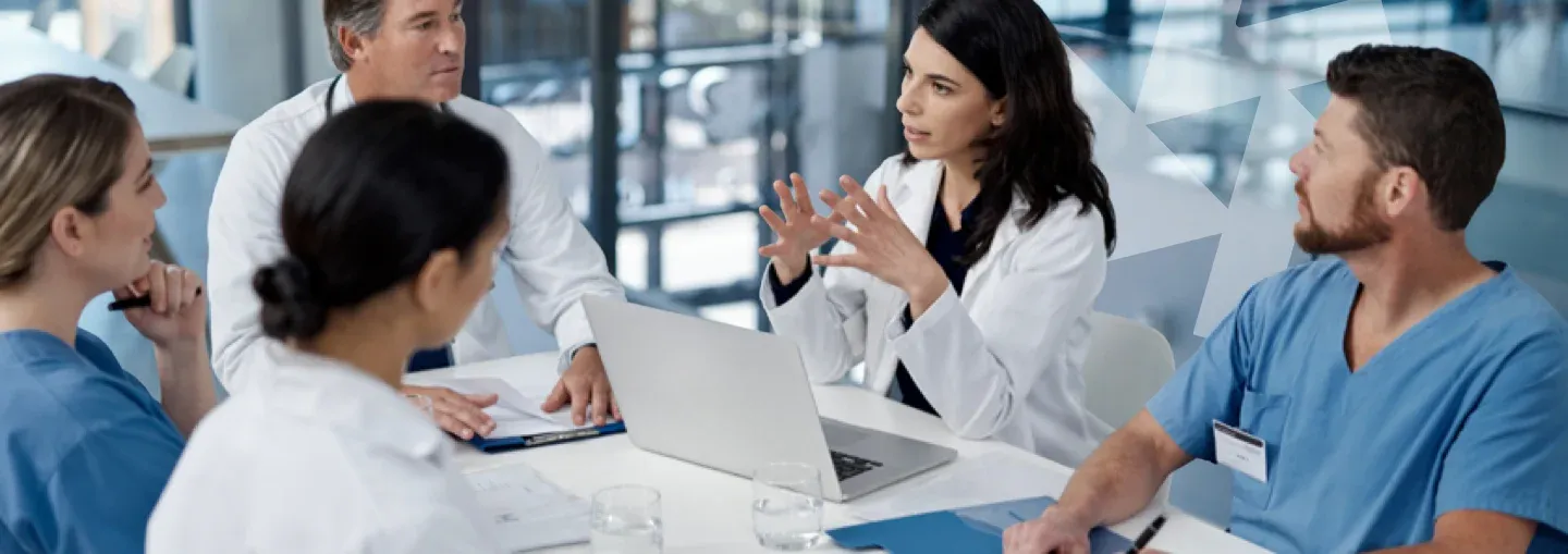 Medical professionals talking in a conference room