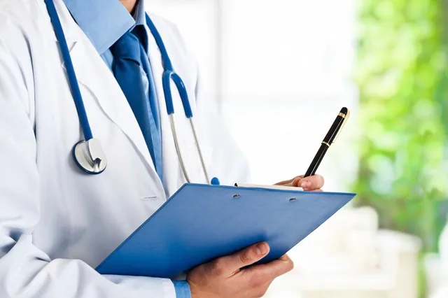 Medical professional holding a clipboard