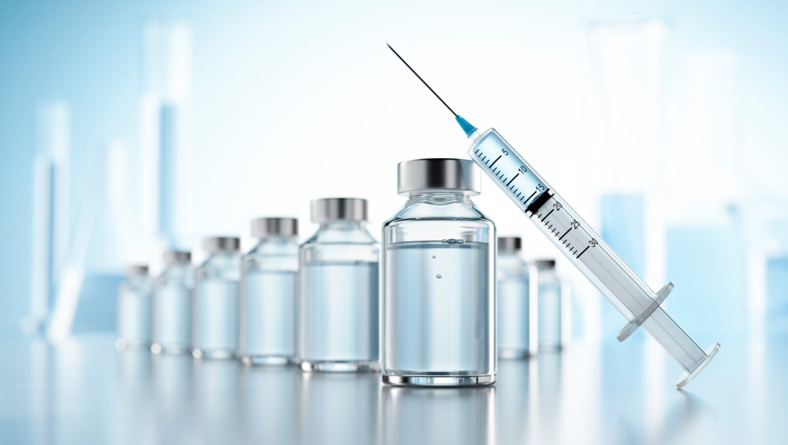A syringe with vials of medicine