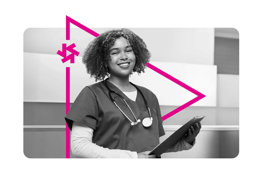 A nurse smiling holding a folder.