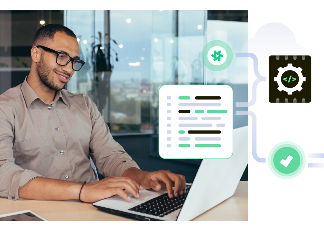 Man smiling at a laptop